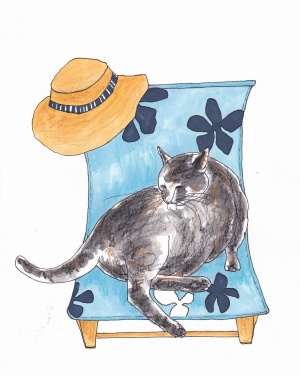 Petit chat dans une chaise longue avec un chapeau de paille.